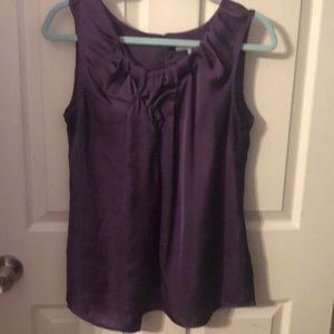Rich purple sleeveless top.